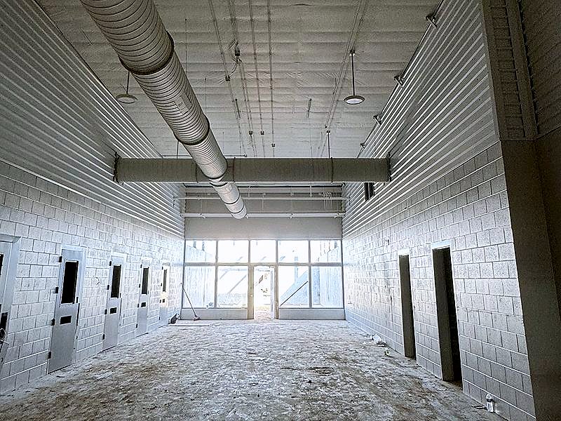 Commercial interior with block walls, liner panel and spiral duct