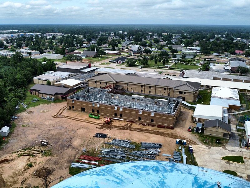 Aerial view of a two-story building addition under construction